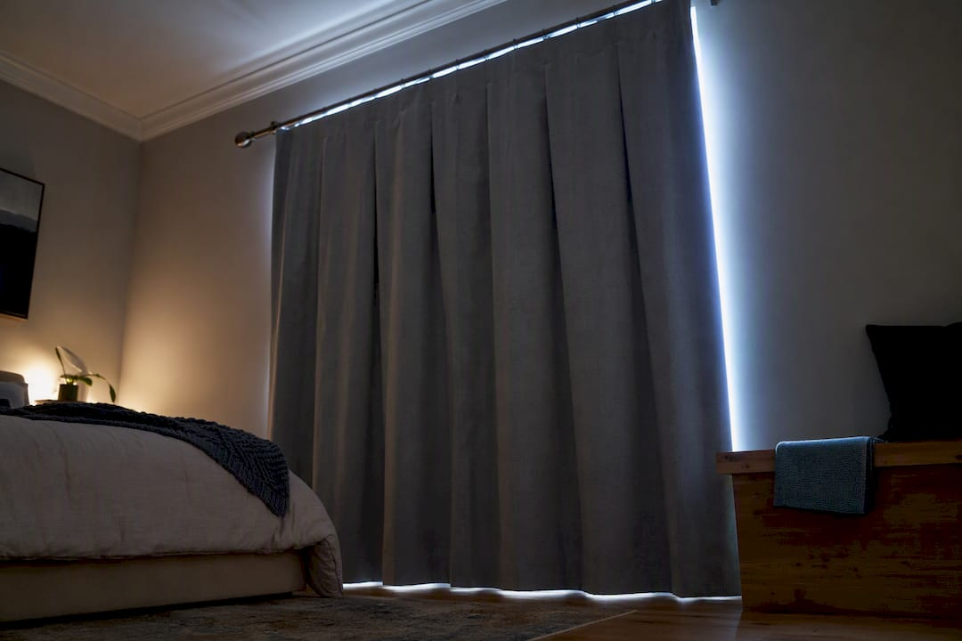 Curtain edges allowing daylight into bedroom